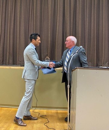 Rivas receiving Legislator of Year award from Ferrante